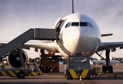 bigstock-Boeing-being-loaded-with-cargo-52416166.jpg